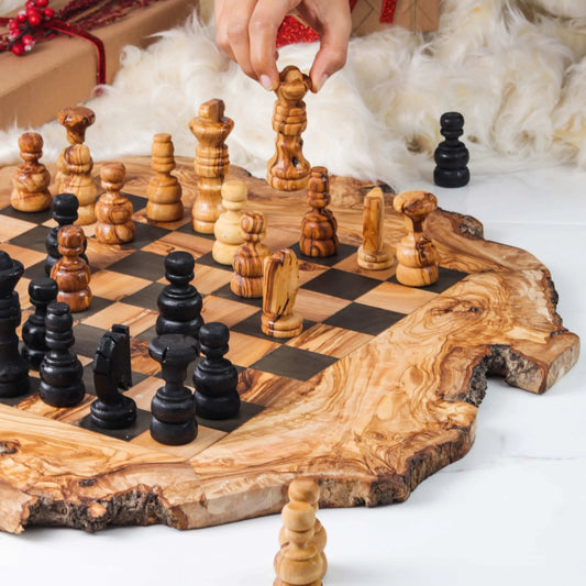 Handcrafted olive wood chess set on display with pieces in play and a rustic board design